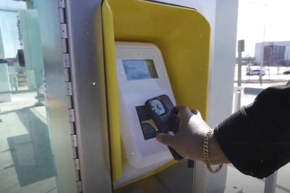 Person scanning phone on CONNECT validator
