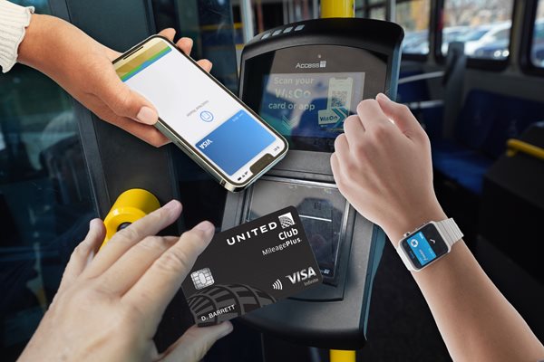 Image of hands holding different payment options in front of the validator