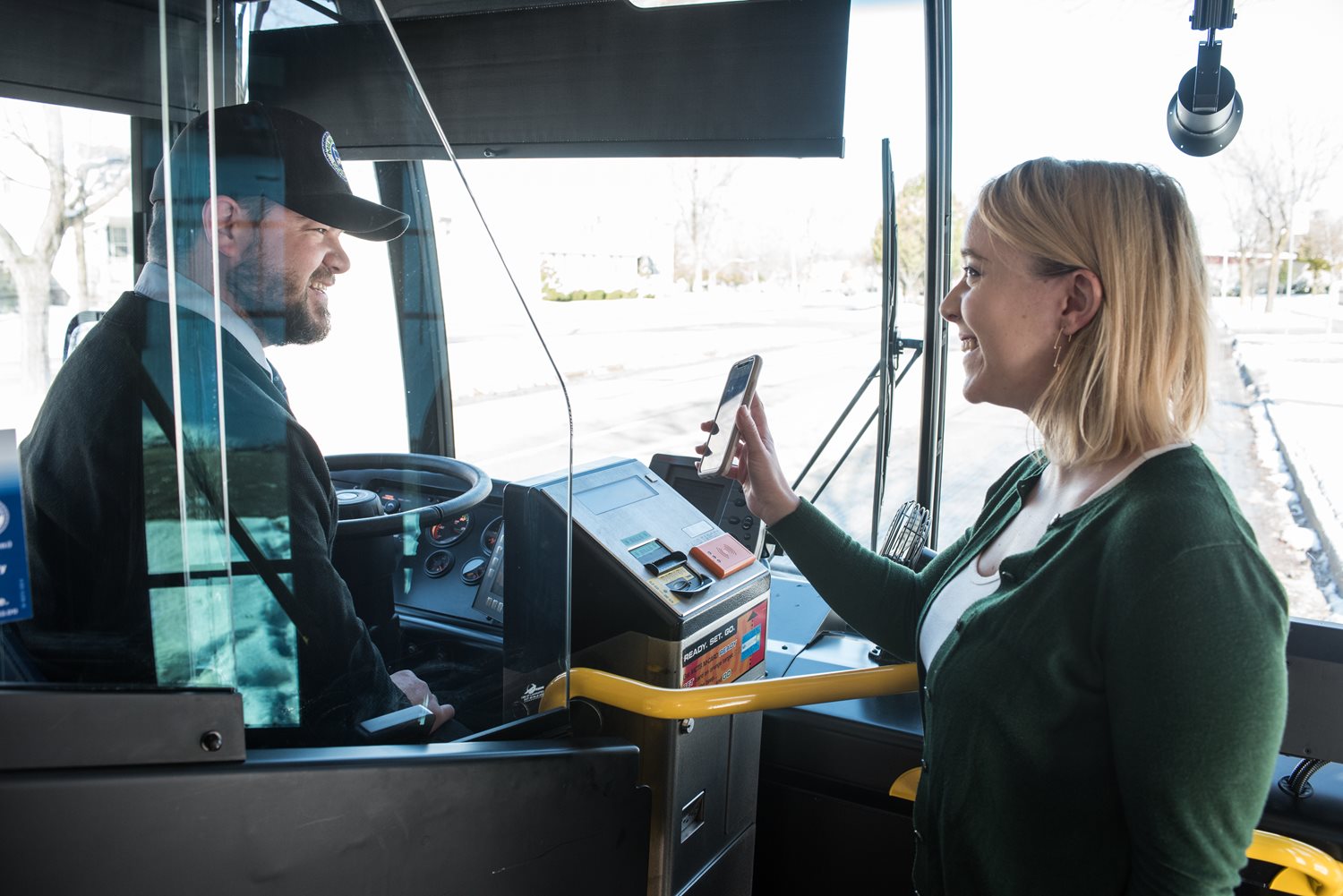 Rider showing driver their app