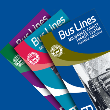 Three issues of the BusLines passenger newsletter stacked on each other