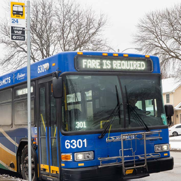 Picture of MCTS bus at a stop with "Fare is Required" on the destination sign